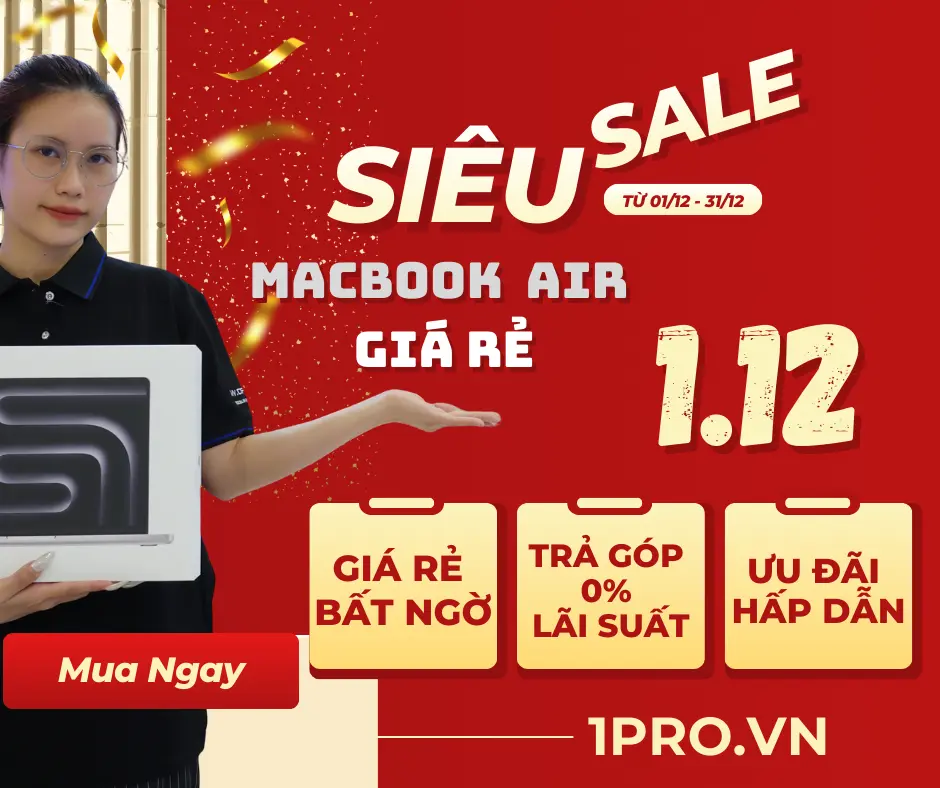 Người dùng Macbook Air làm việc tại bàn với màn hình sáng rõ